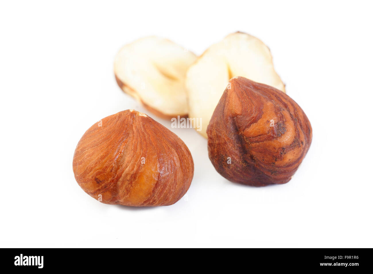 peeled hazelnuts isolated on white background Stock Photo