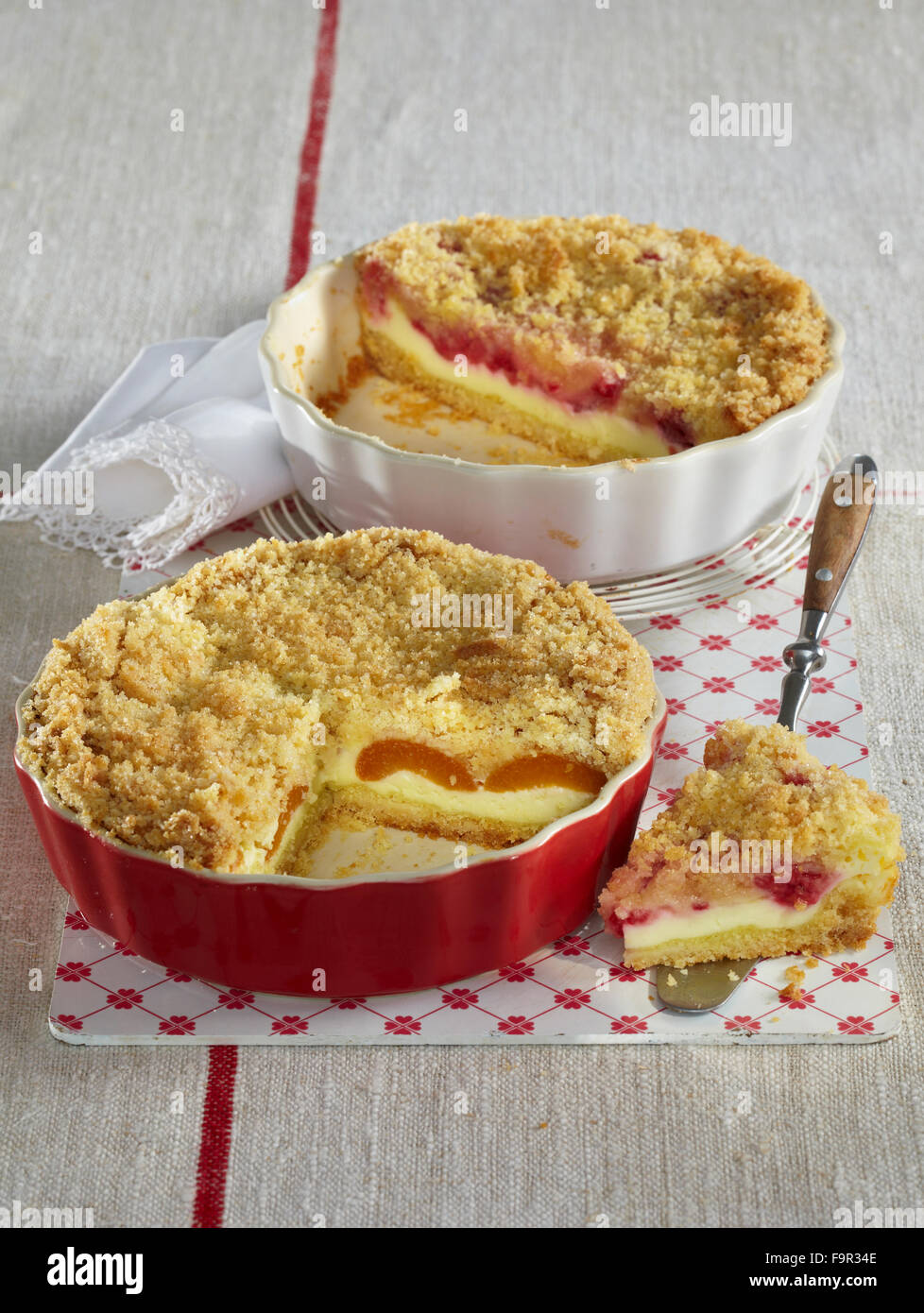 Streusel cake with apricots and raspberries Stock Photo - Alamy