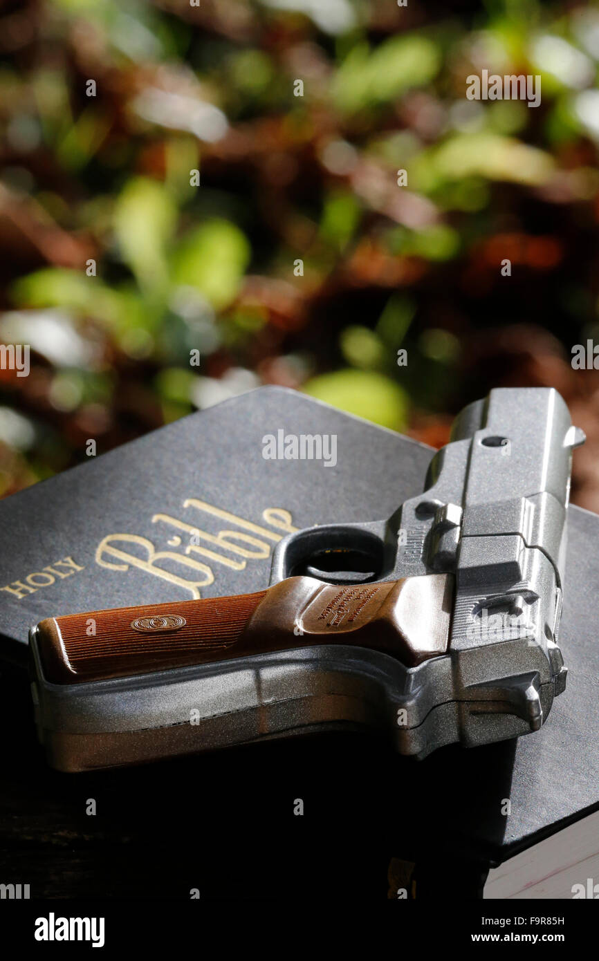 Holy Bible and gun Stock Photo - Alamy