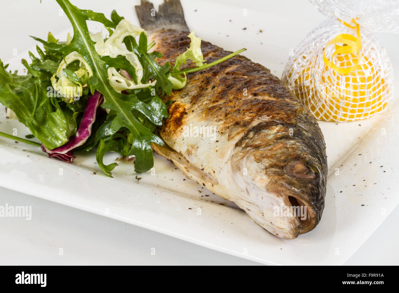 Seabass with vegetables Stock Photo Alamy