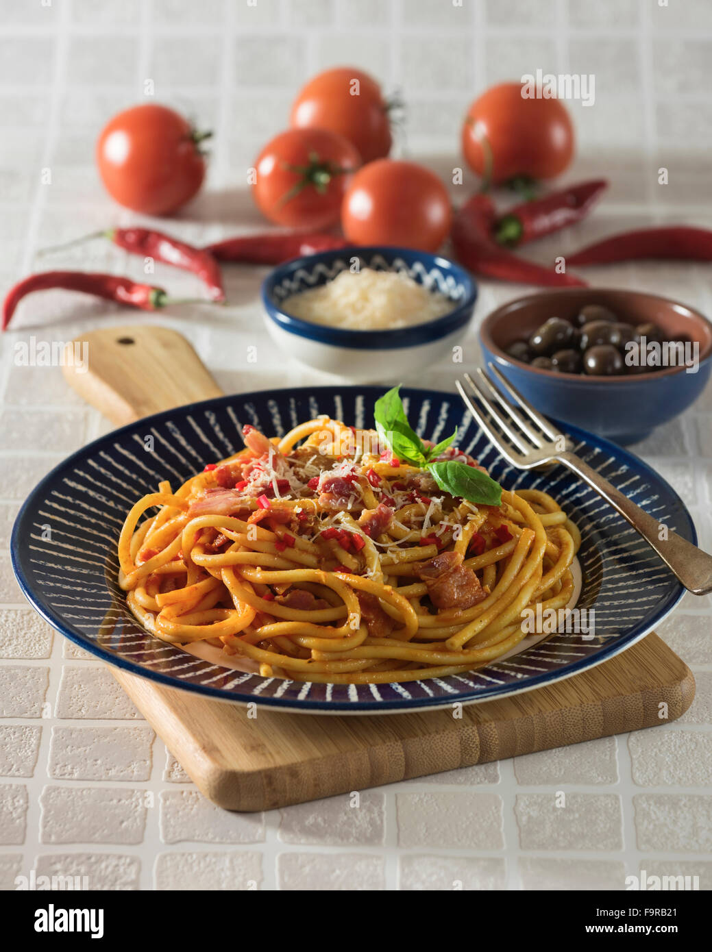 Bucatini all'amatriciana.Pasta with bacon and tomato sauce. Italian food. Stock Photo