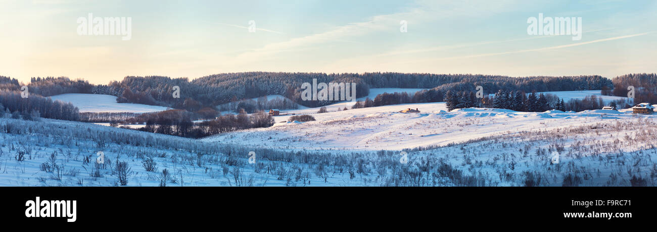 Panorama of Winter hills. Frozen meadow. Frost on trees Stock Photo