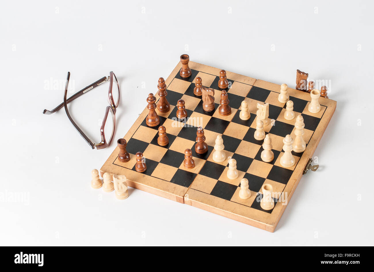 the chess game board is photographed on a white base Stock Photo