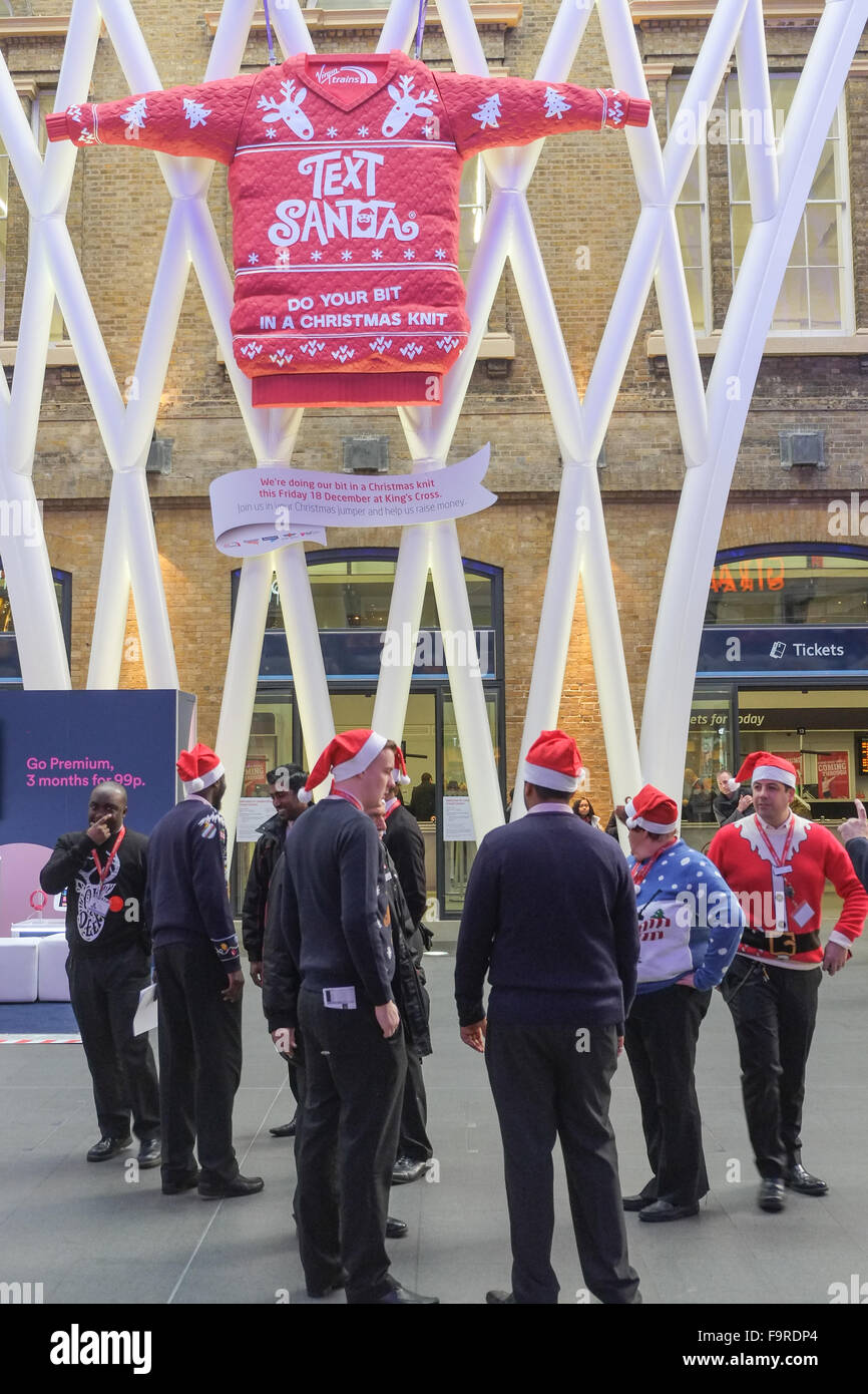 Kings Cross Station, London, UK. 18th December 2015. Virgin Trains staff celebrate Christmas jumper day in Kings Cross station © Stock Photo