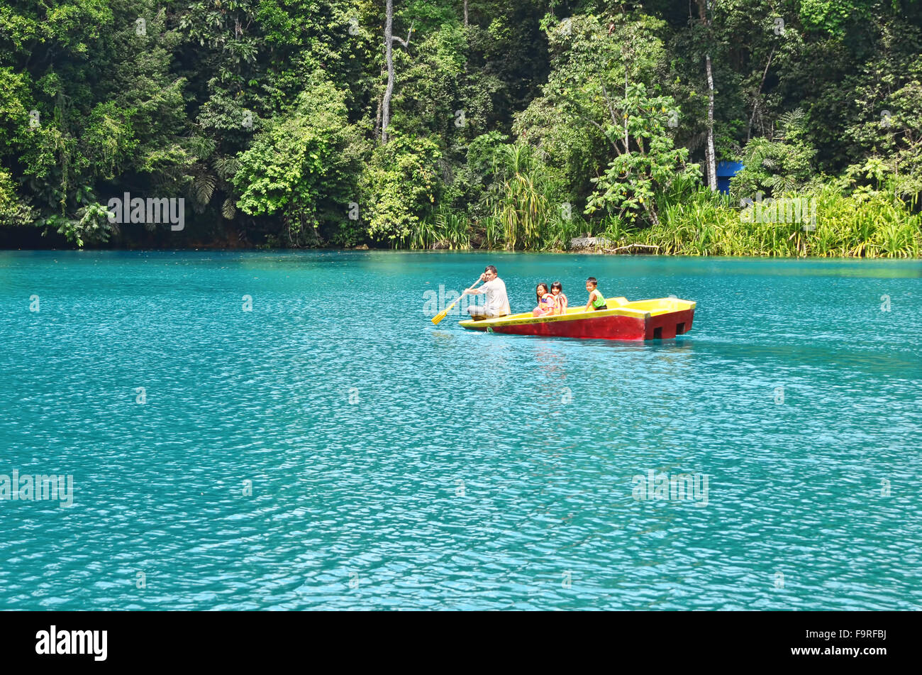 A boat in Labuan Cermin Lake Stock Photo