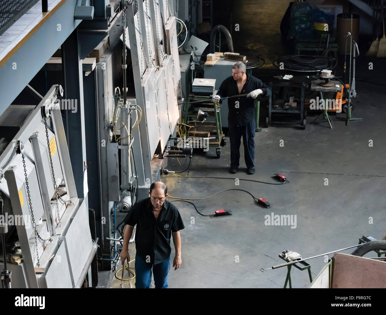 Glassblowers at work at the furnace of the traditional glass blowing