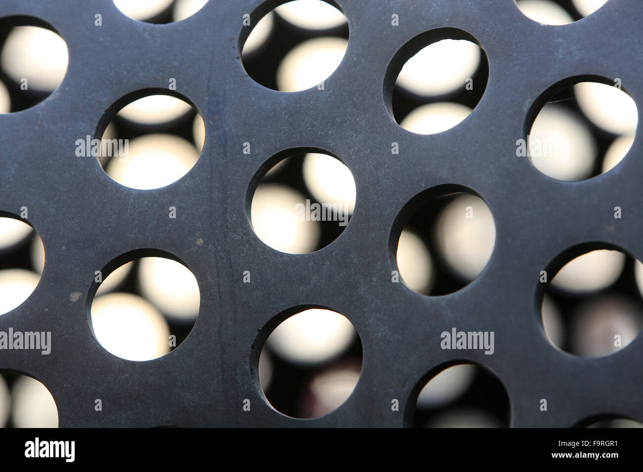 Holes in a metal ball. Stock Photo