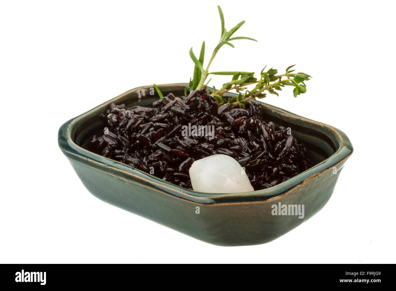 Black boiled rice with thyme Stock Photo