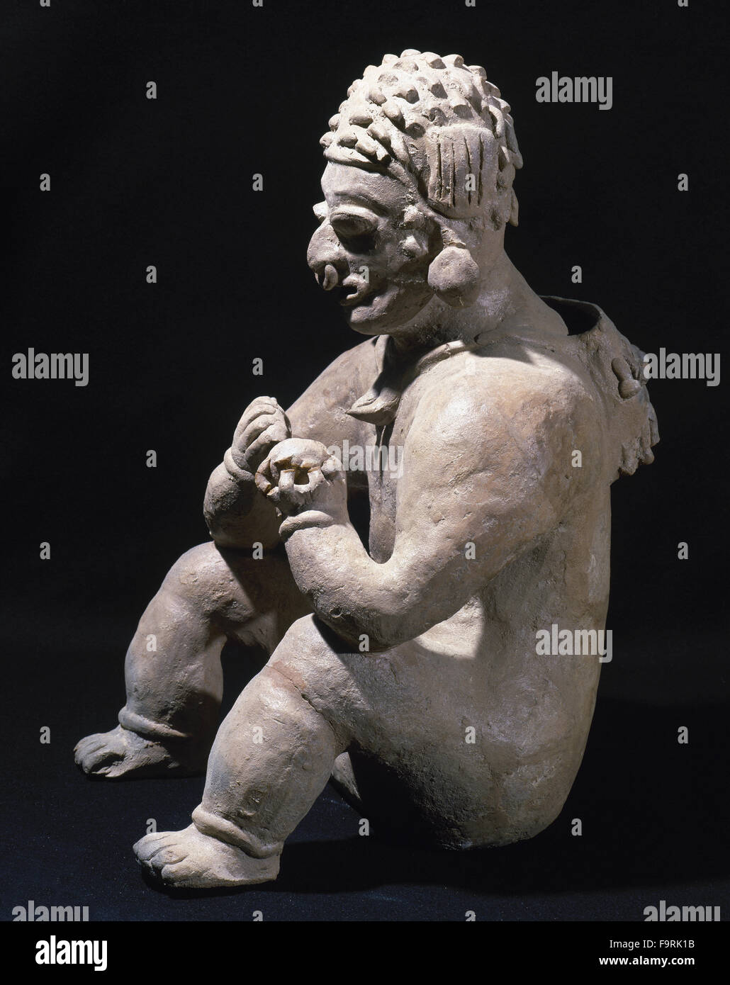 The Ancient Jama-Coaque Culture. Northern coast of Ecuador. 500 BC-500 AD. Ceramic  figure. Seated man. Mold. Style chone. 37 x 20 cm. Private collection. Stock Photo