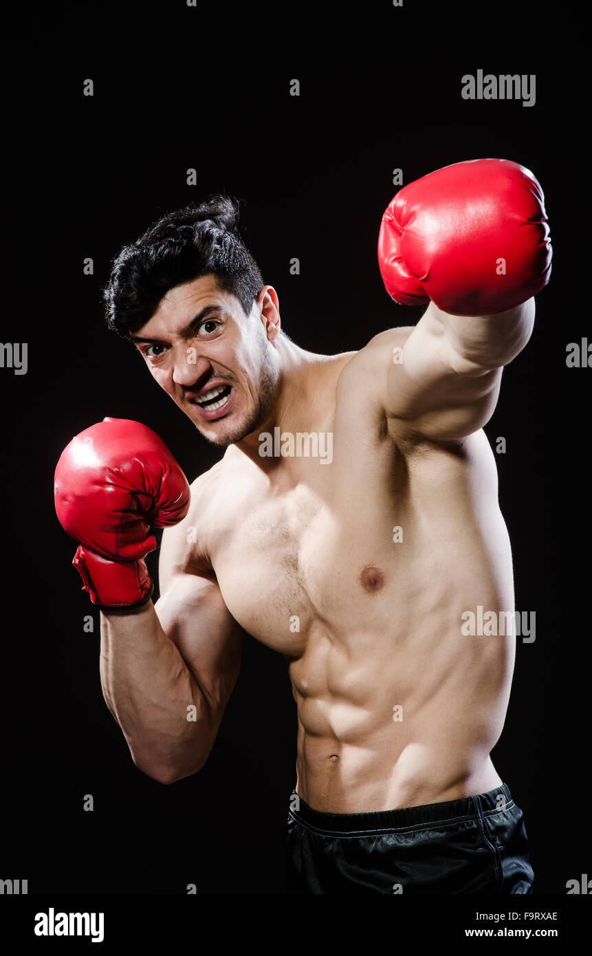 Muscular man in boxing concept Stock Photo - Alamy