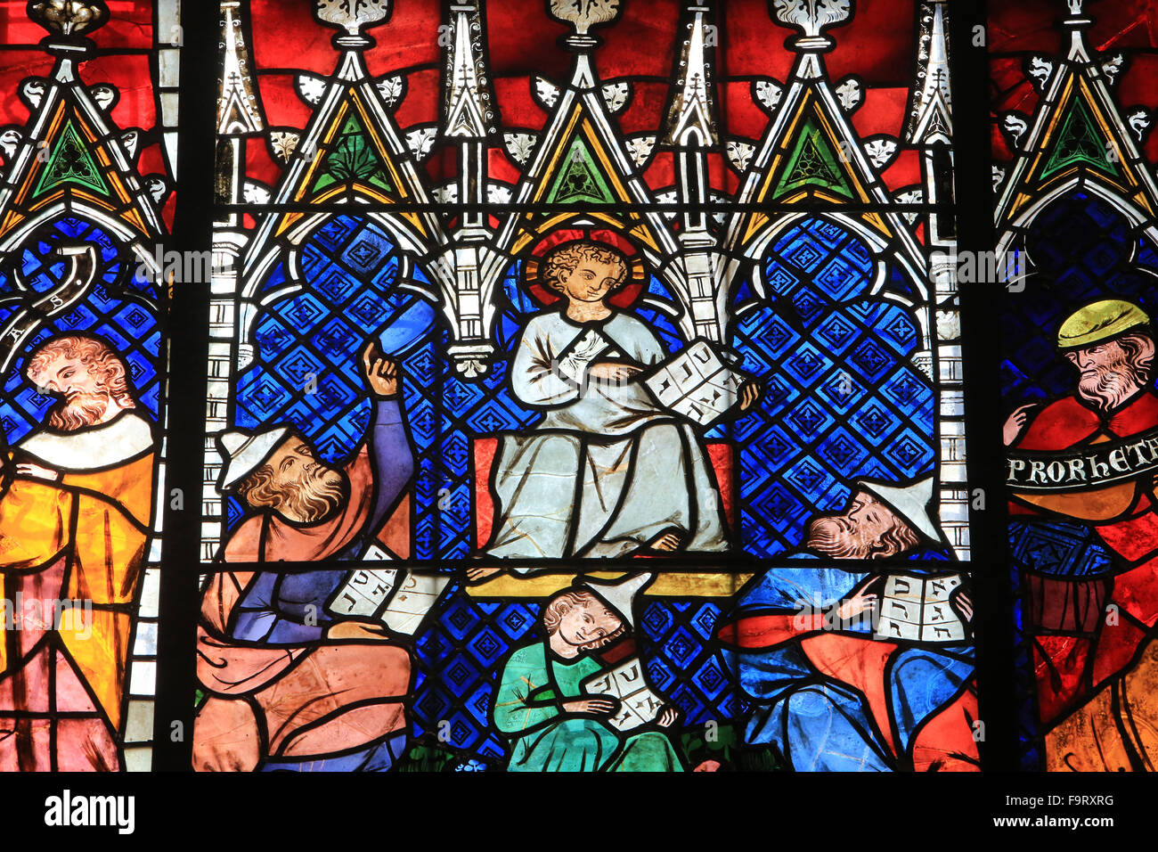 Jesus and the doctors of the Law. Stained glass window. Details. 14th century. Lower South side of the nave. Our Lady of Strasbo Stock Photo