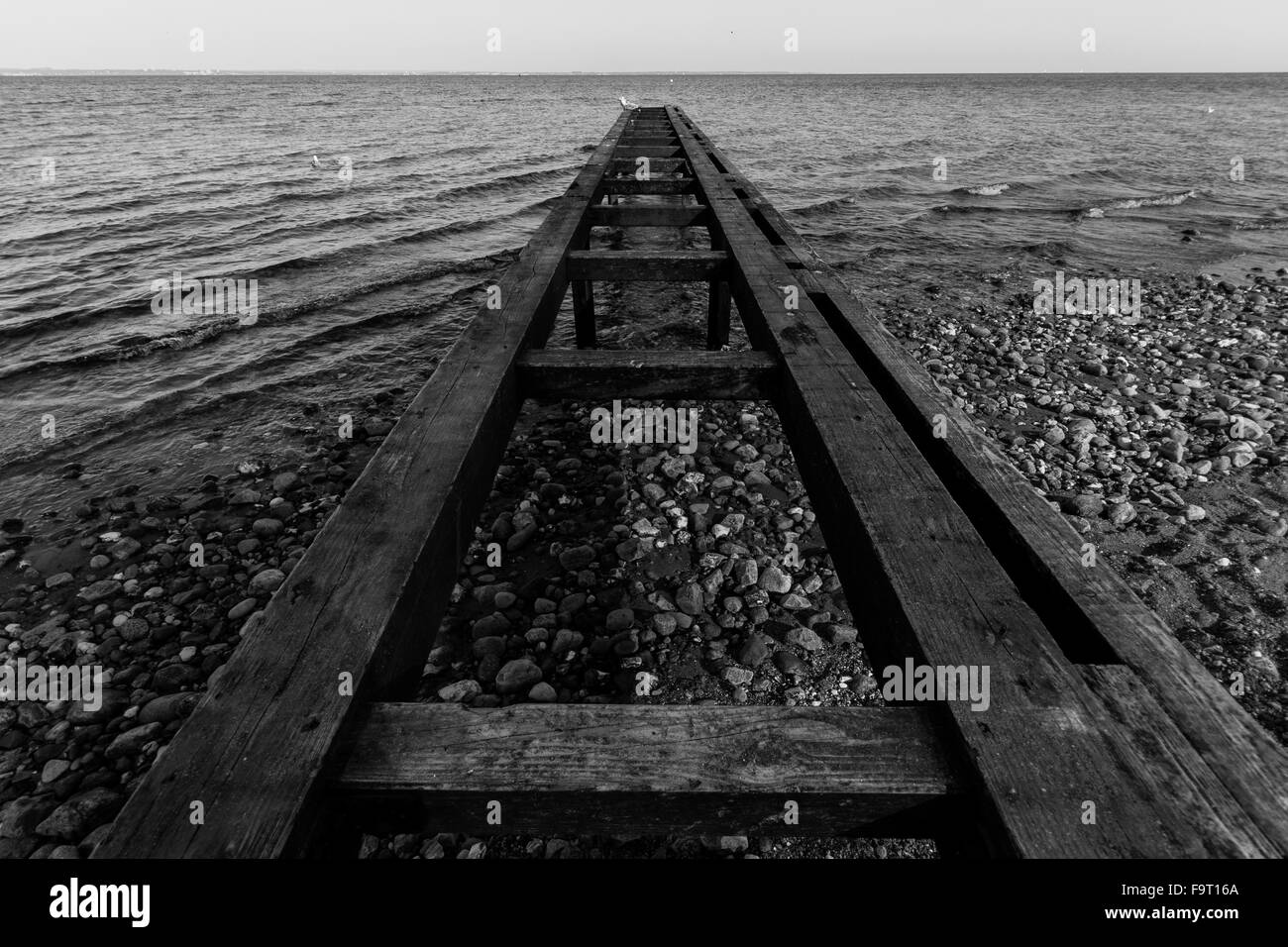 Entrance to the sea in black and white Stock Photo