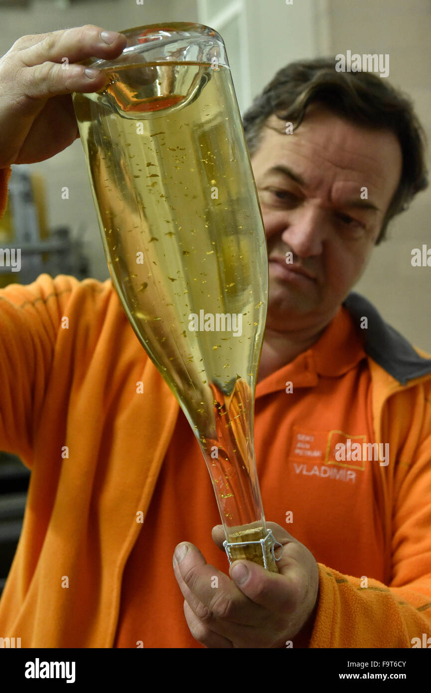 Kobyli, Czech Republic. 18th Dec, 2015. Vladimir Hribal (pictured) and his wife are the second generation of producers of the sparkling wine made from mostly ecologically grown hand-picked grapes. Family vinery Jan Petrak to create the most special sparkling wine, which is made using the classic Methode Champenoise - secondary fermentation in the bottle. Delicate and lasting sparkling is carried by flakes of 24 carat gold in Kobyli, Czech Republic, December 18, 2015. © Vaclav Salek/CTK Photo/Alamy Live News Stock Photo