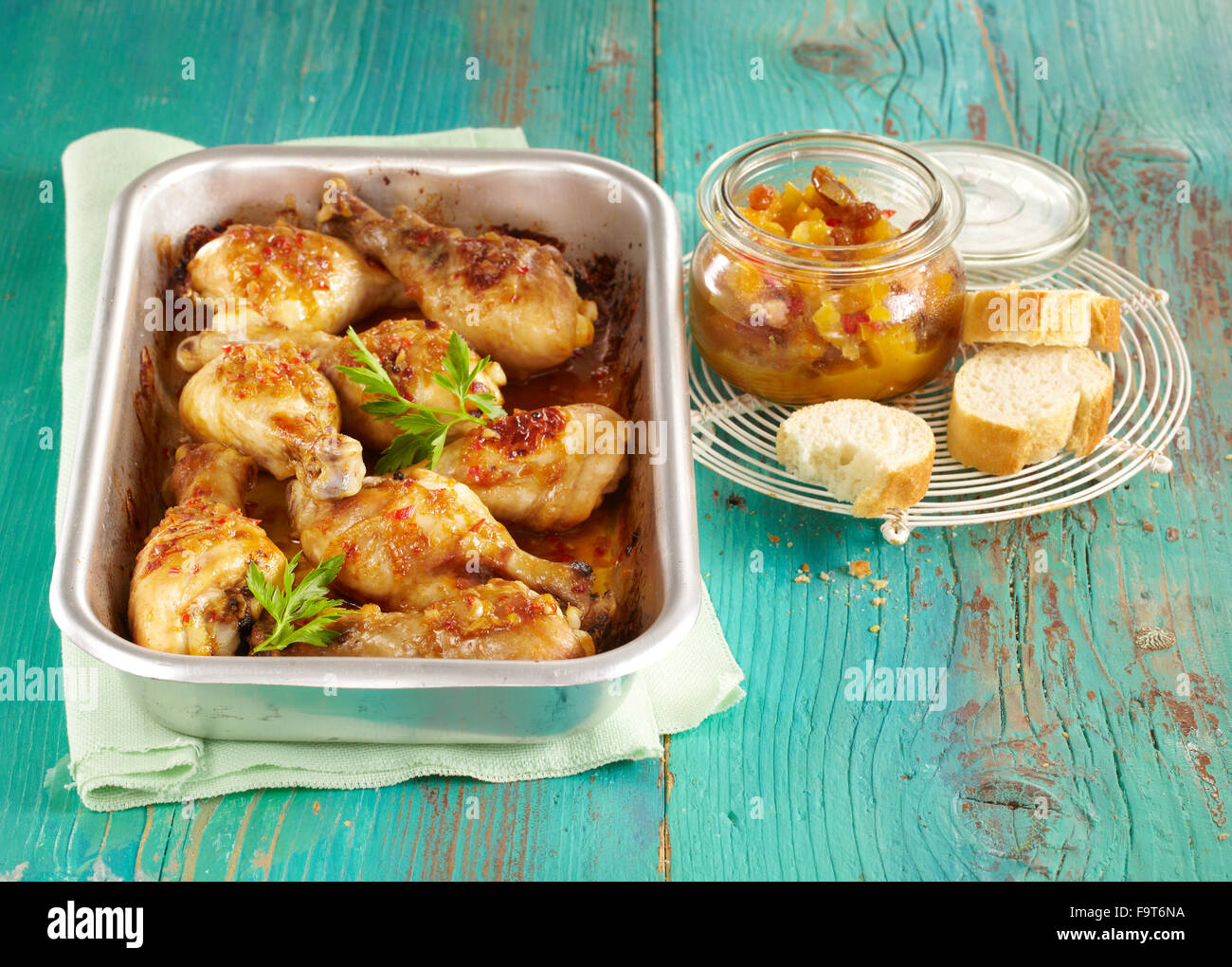 Chicken drumsticks with apricot and ginger chutney + steps Stock Photo