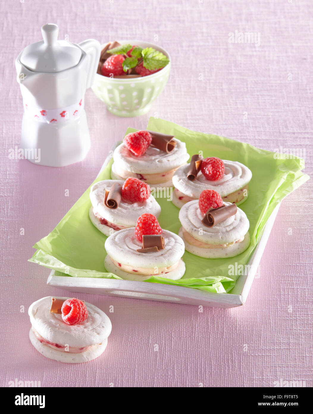 Little meringues with raspberries Stock Photo Alamy