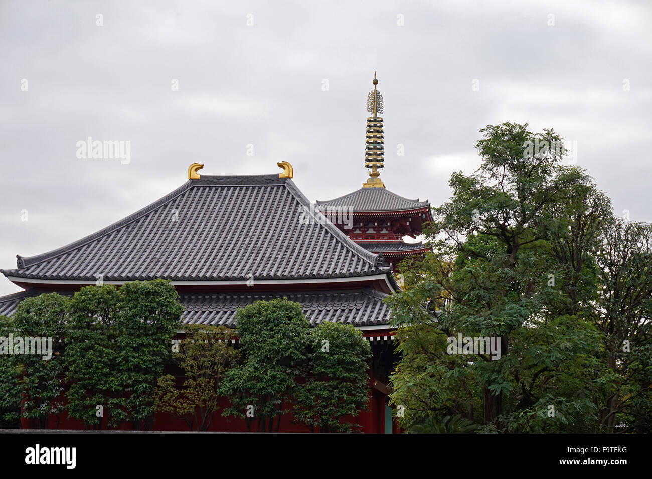 The roof of the main hall and the top of the pagoda Senso-ji Buddhist Temple, Asakusa, Tokyo, Japan Stock Photo