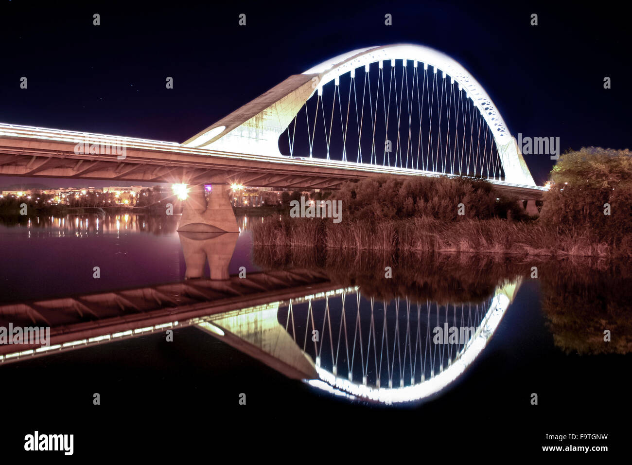 Lusitania bridge over Guadiana River at night, Merida, Spain Stock Photo