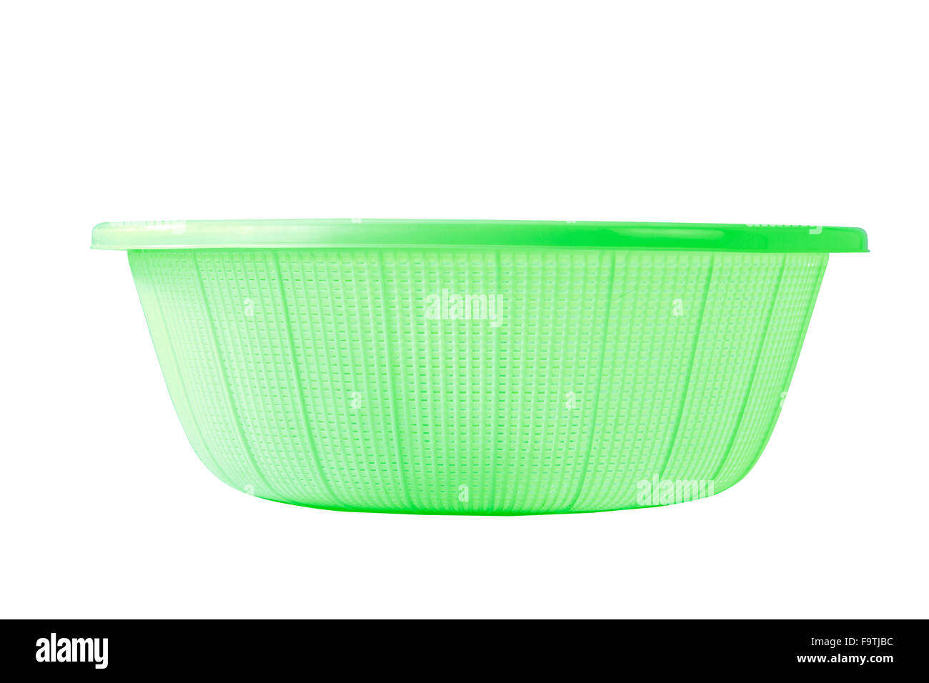 green plastic basket on a white background Stock Photo