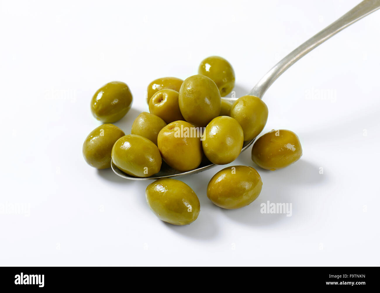 Unpitted brine cured green olives Stock Photo Alamy