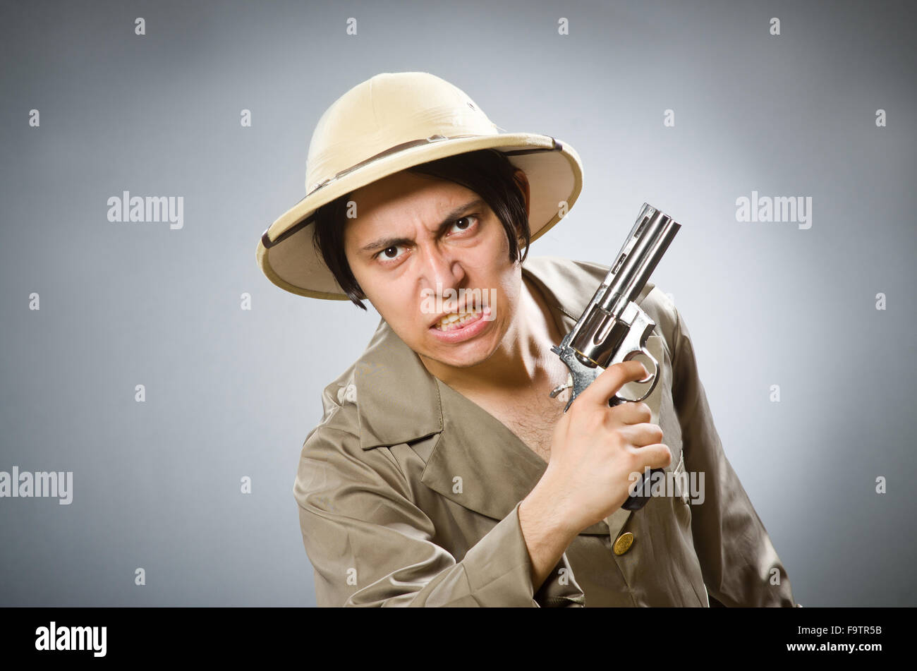 Man wearing safari hat in funny concept Stock Photo - Alamy