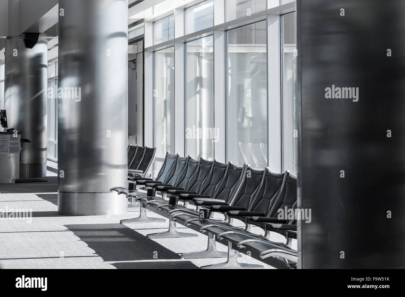 Empty Seats At Airport Gate Waiting Area With Windows, Denver Colorado, USA Stock Photo