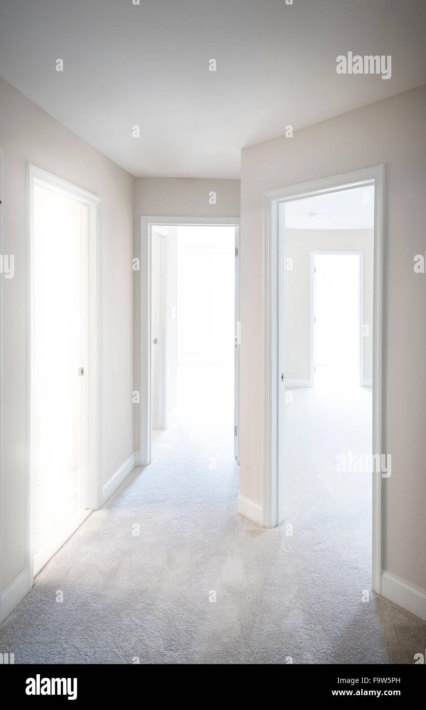 Hallway With Doors And Bright Light Stock Photo