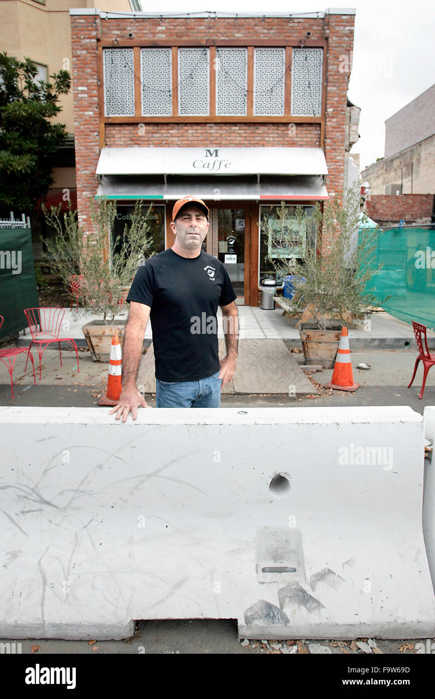 Napa, CA, USA. 18th Dec, 2015. Rick Molinari is seen outside his Brown Street business, Molinari Caffe. He estimates his losses due to the August 2014 earthquake to be about $100,000 and wishes the city would remove the concrete barriers in front of his cafe. © Napa Valley Register/ZUMA Wire/Alamy Live News Stock Photo