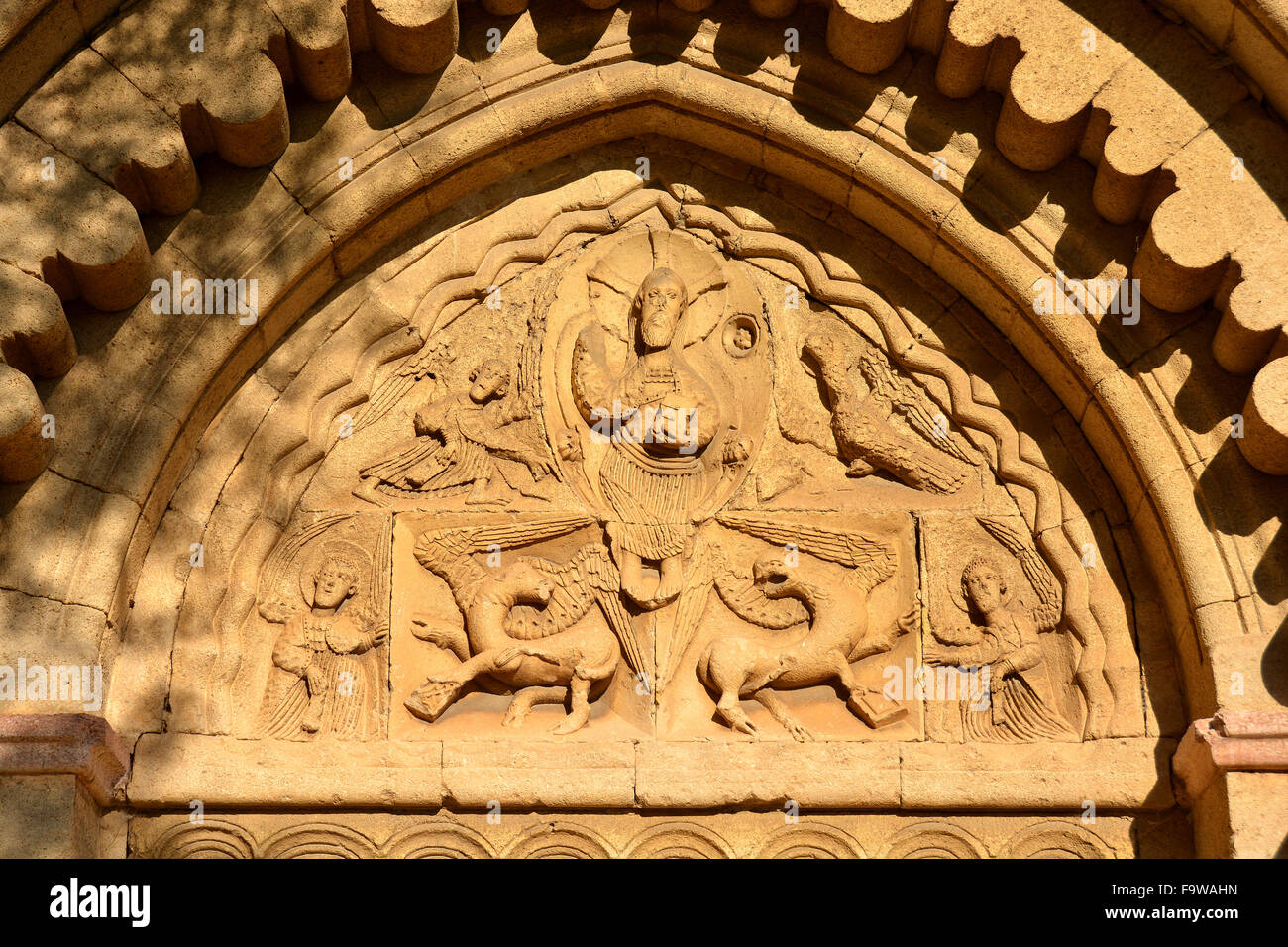 Ganagobie priory church tympanum Stock Photo - Alamy