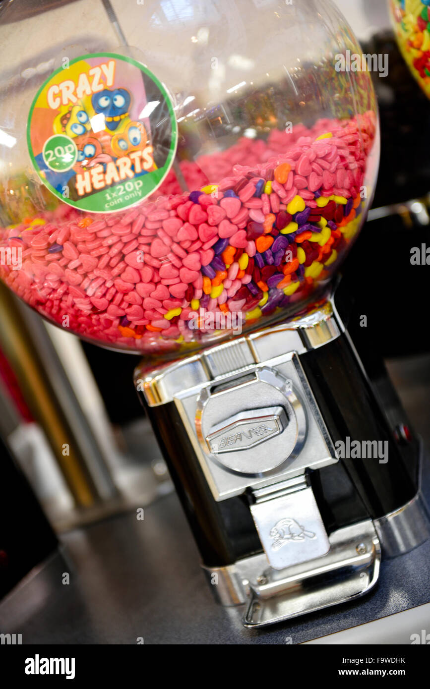 Crazy Hearts sweets  in coin operated candy dispensing machine in shopping centre Stock Photo