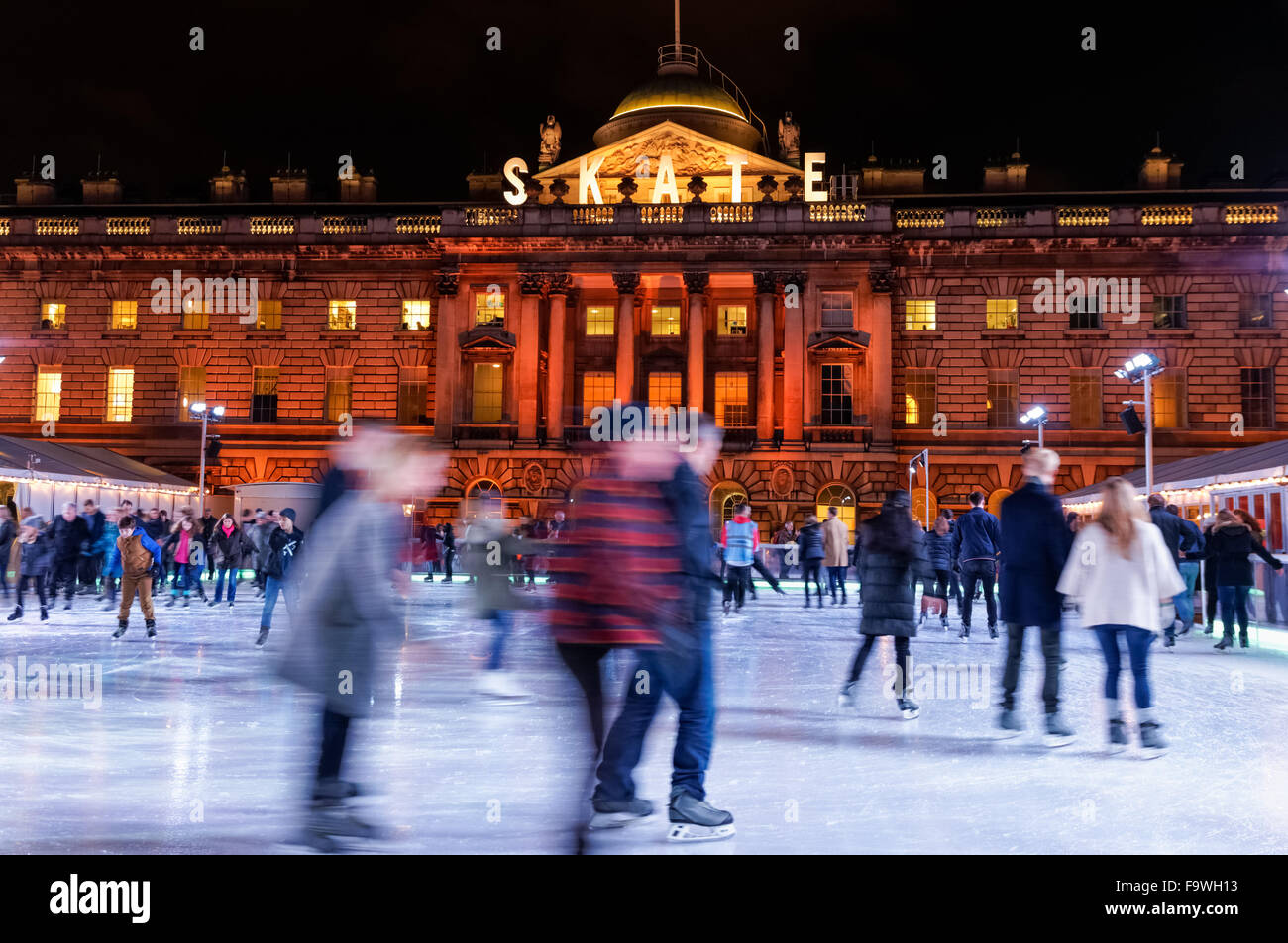People ice skating at Somerset House Ice Rink, London England United