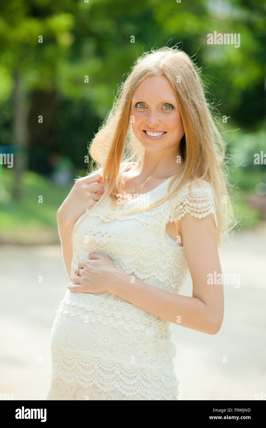 Image of radiant pregnant woman walks in the park in summer Stock Photo ...