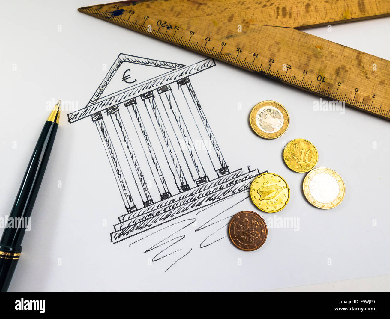 Drawing of a tax office, ballpen, ruler and coins Stock Photo