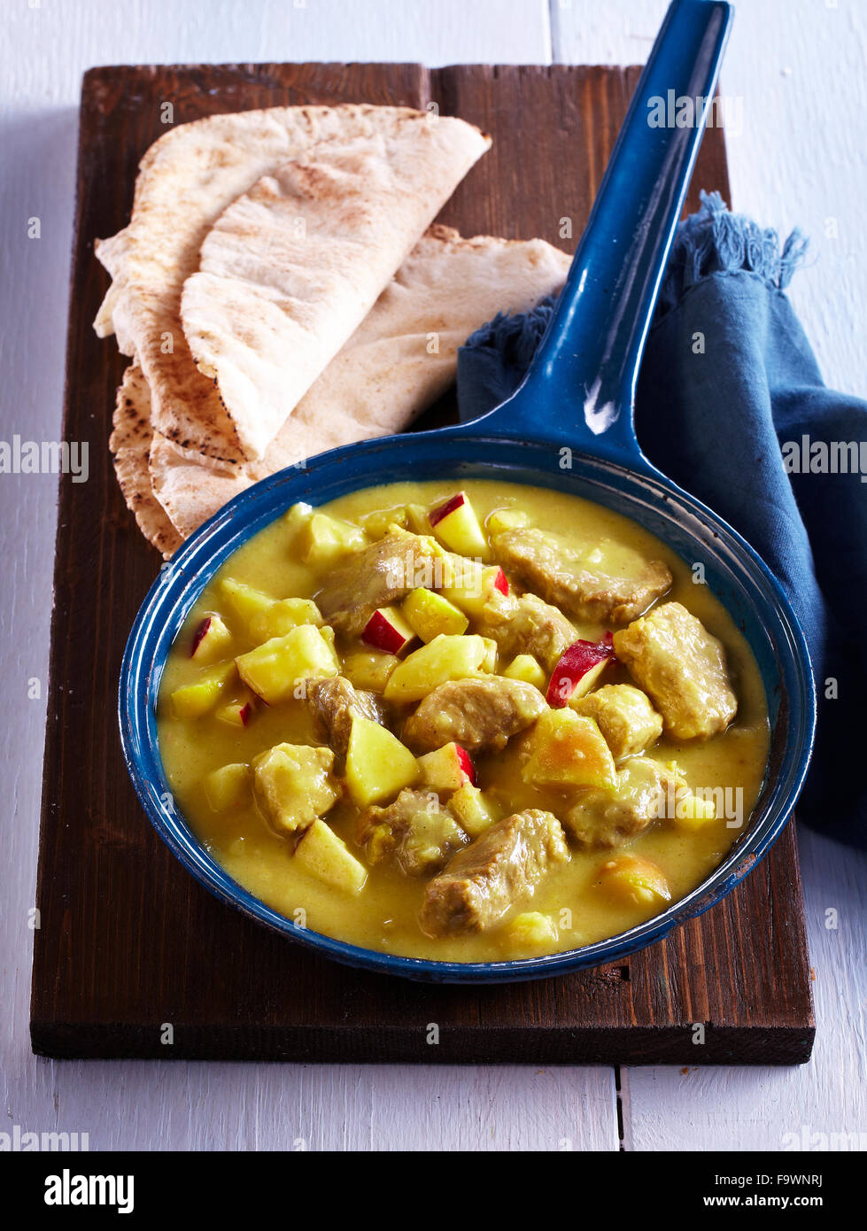 Pork curry with root celery and apples Stock Photo Alamy