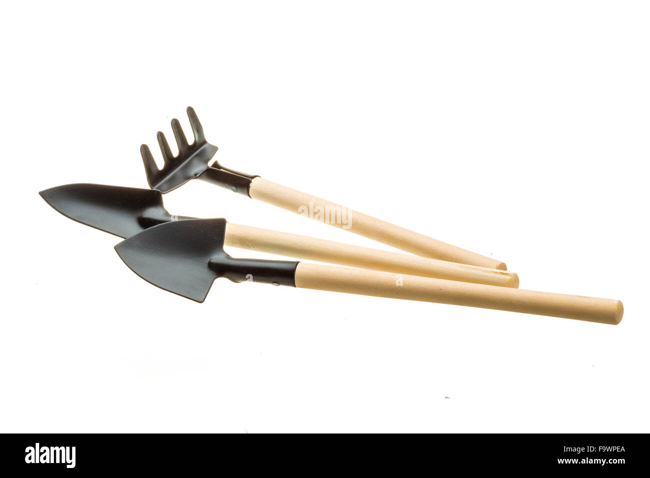 Two Shovel and Rake isolated Stock Photo - Alamy