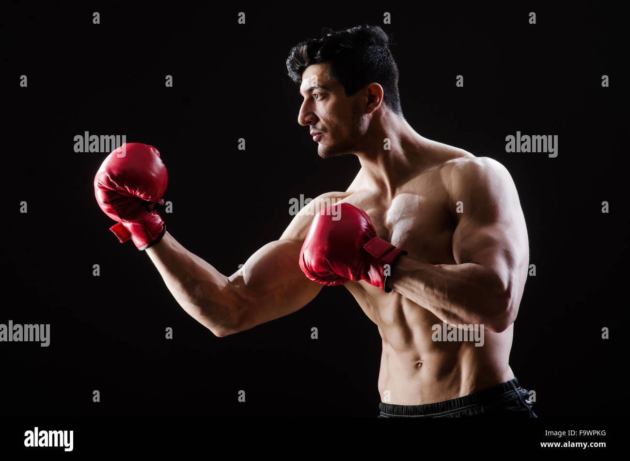 Muscular man in boxing concept Stock Photo - Alamy