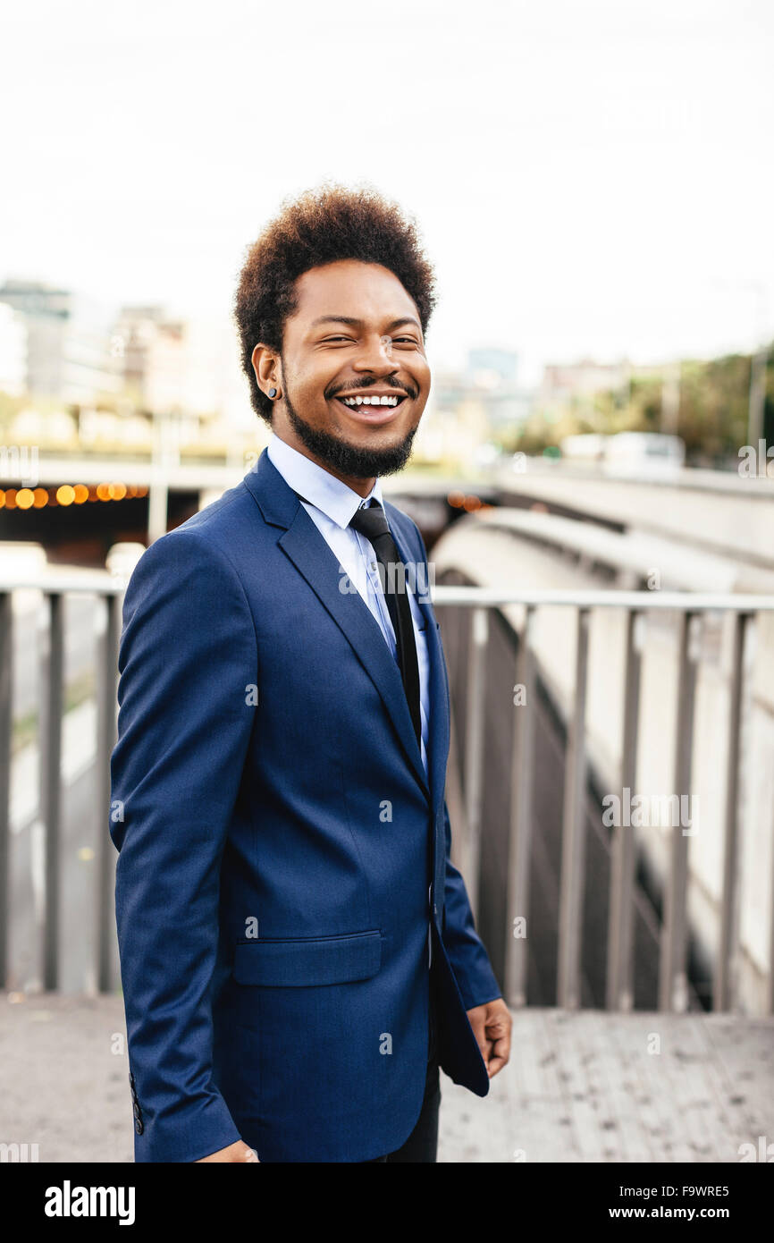 Portrait of smiling businessman wearing blue suit Stock Photo - Alamy