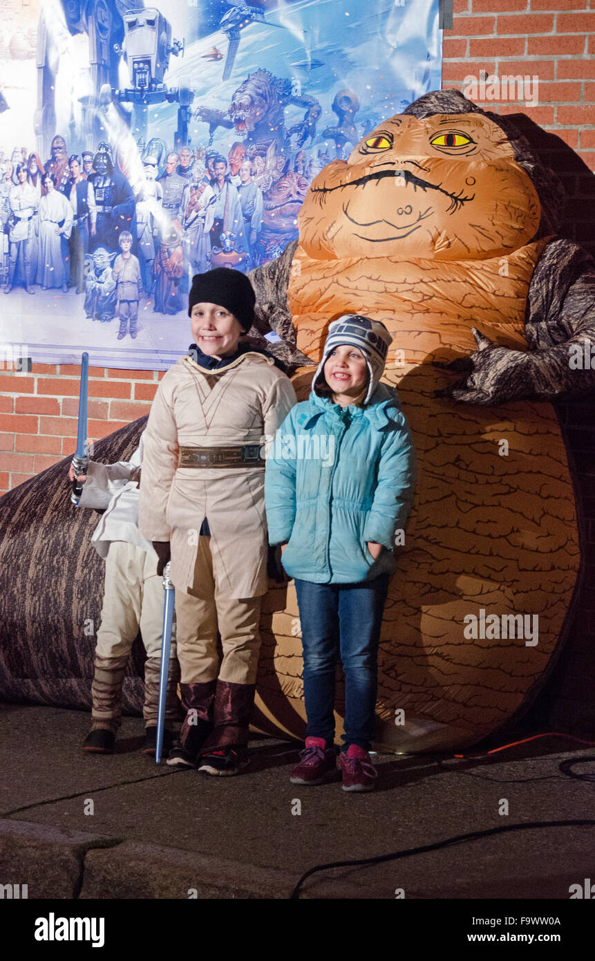 Bar Harbor, Maine, USA. 18th December, 2015. Fans pose in front of an inflatable Jabba the Hut at the opening night of Star Wars: The Force Awakens at the historic Criterion Theater.  Credit: Jennifer Booher/Alamy Live News Stock Photo