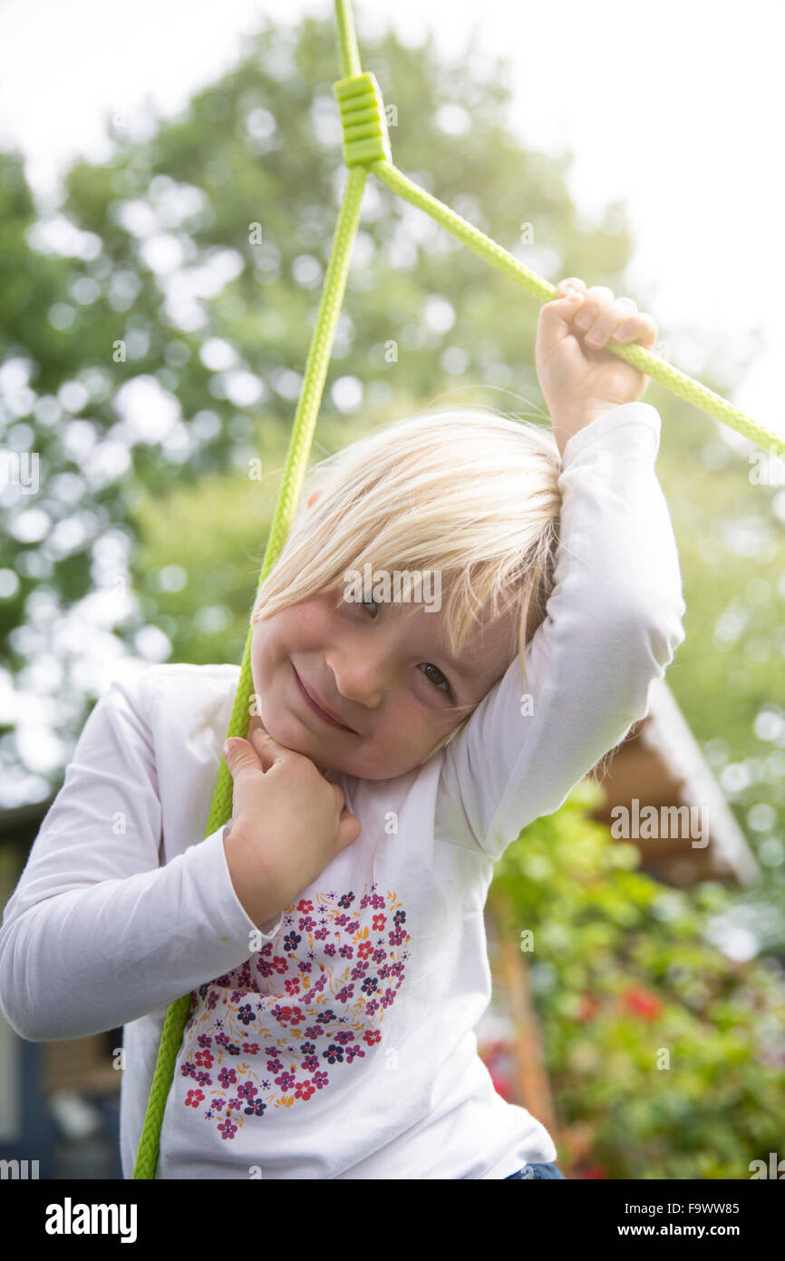 Portrait of smiling blond girl outdoors Stock Photo - Alamy