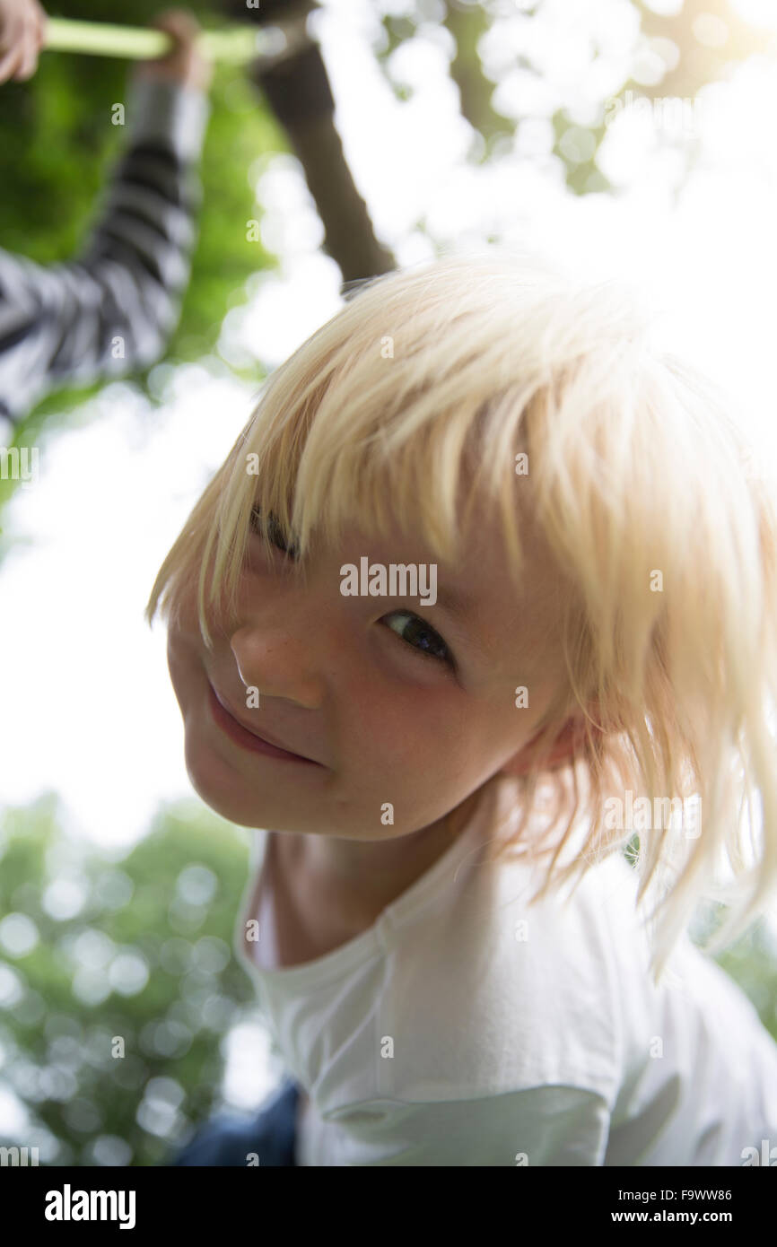 Portrait of smiling blond girl outdoors Stock Photo - Alamy