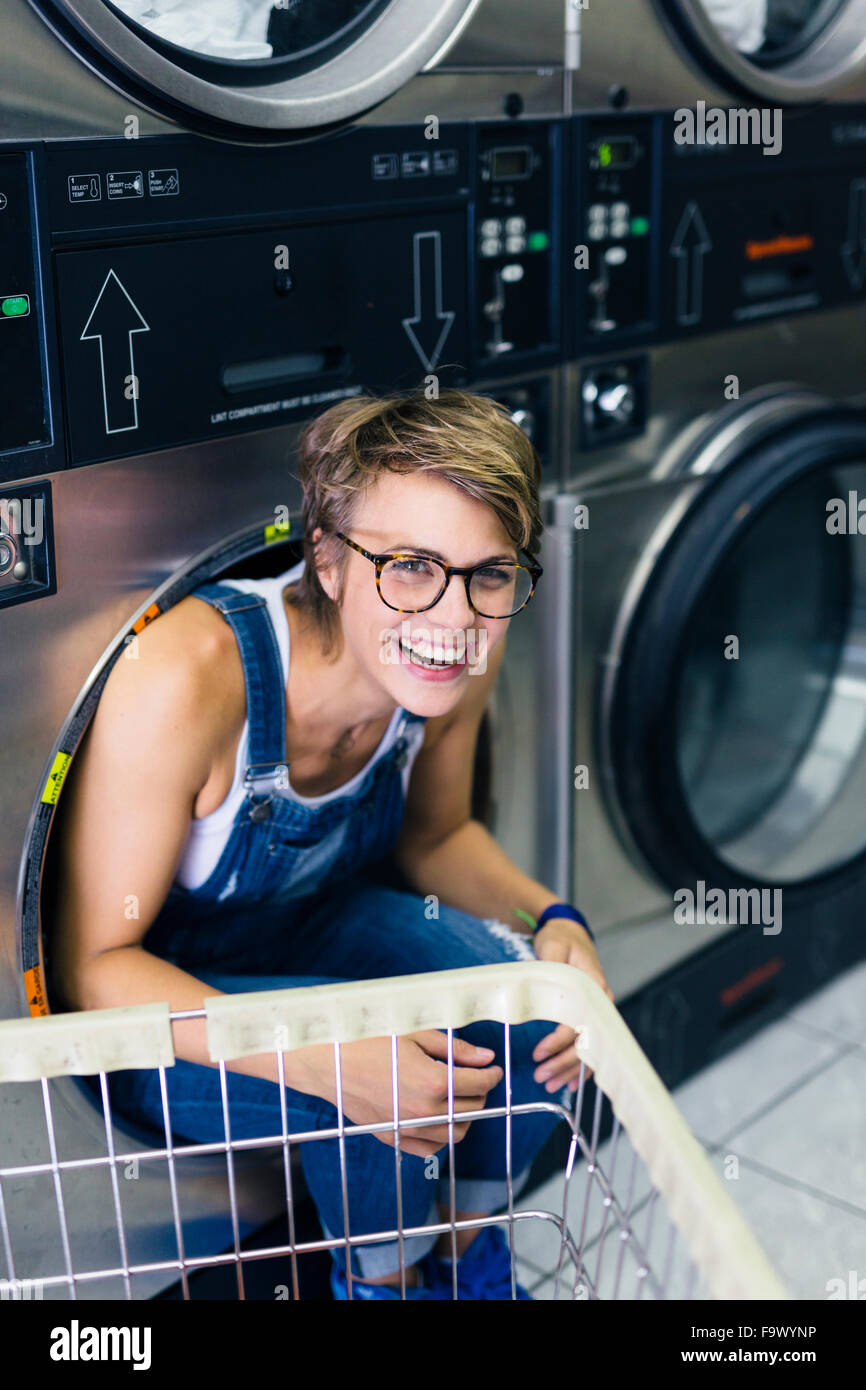 Portrait of laughing blond woman in a laundry Stock Photo - Alamy