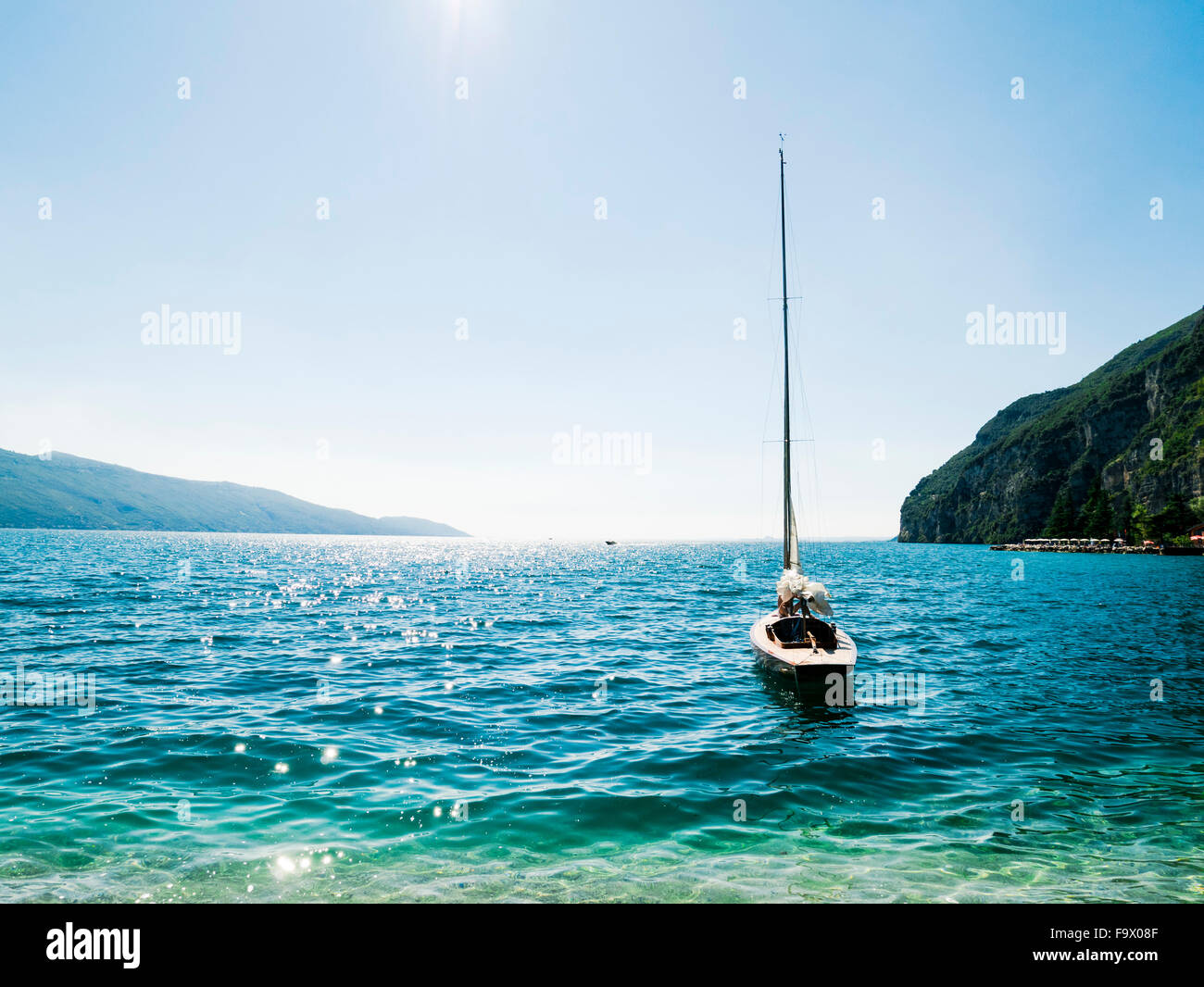 Italy, Lake Garda, Sailing boat at Porto di Tignale Stock Photo