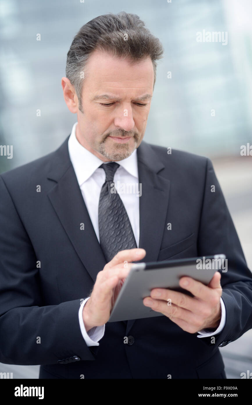 Young businessman using digital tablet Stock Photo - Alamy