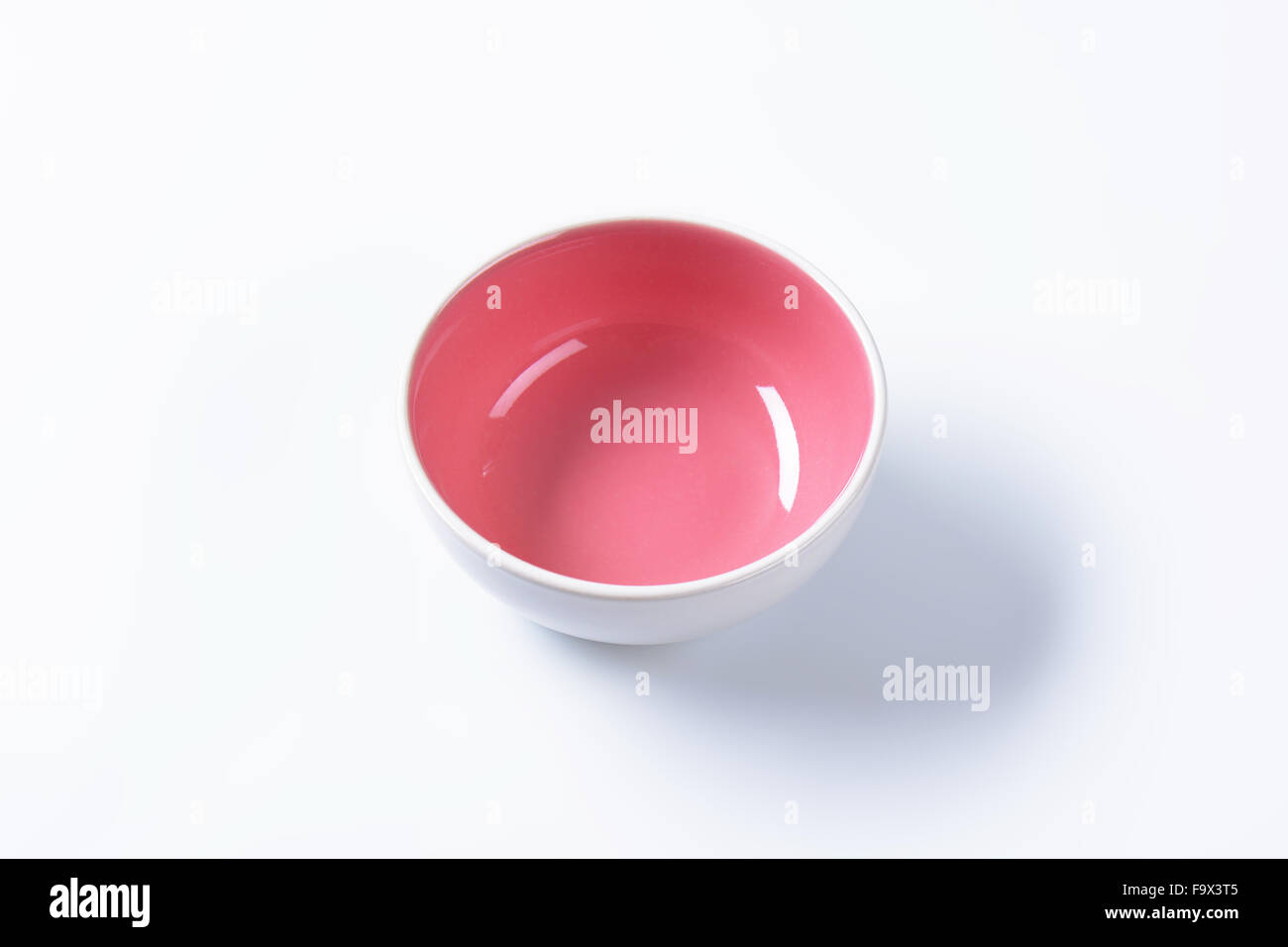 Empty coupe bowl - white on the outside, pink on the inside Stock Photo