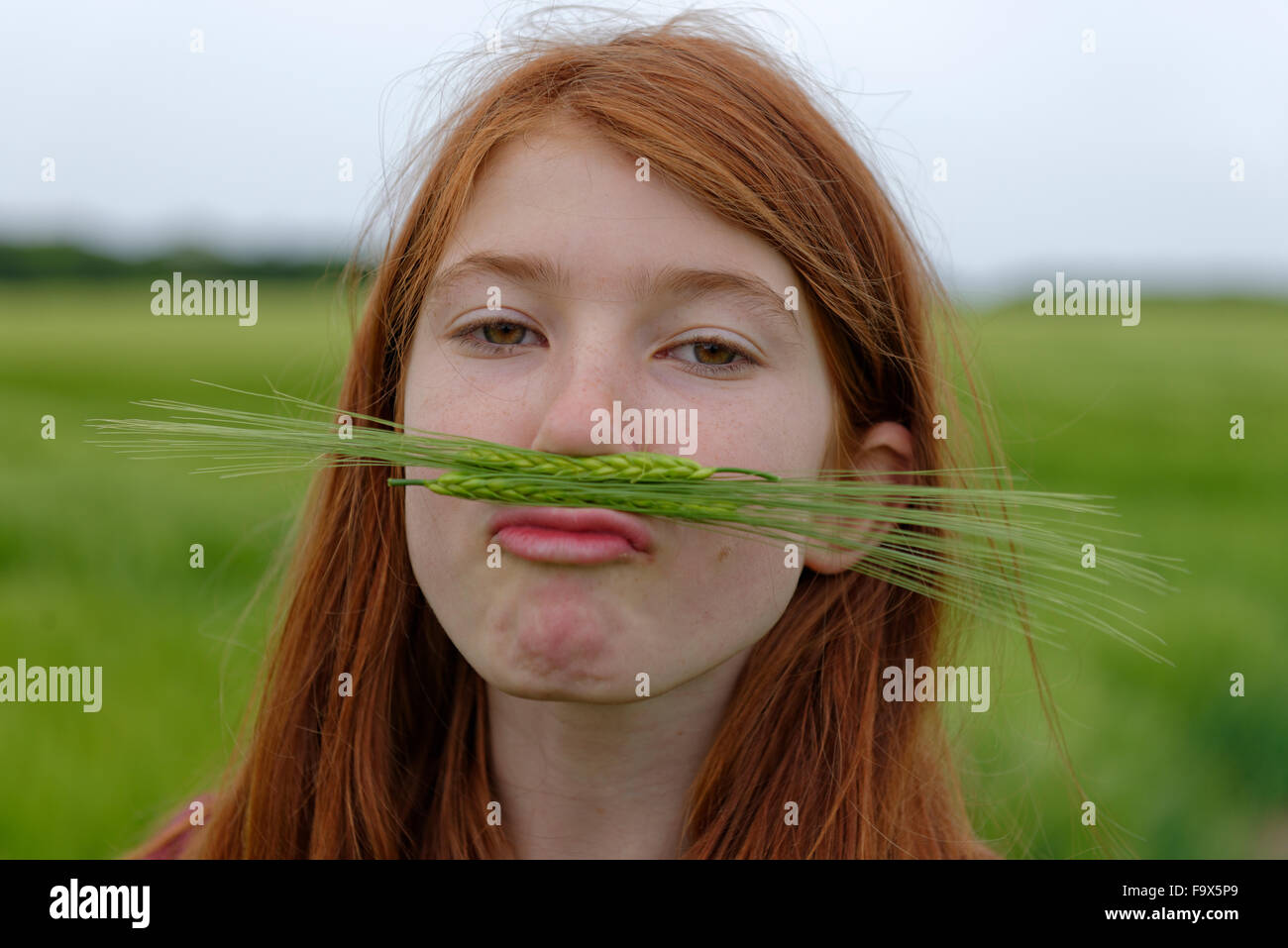 Portrait of teenage girl with barley moustache Stock Photo