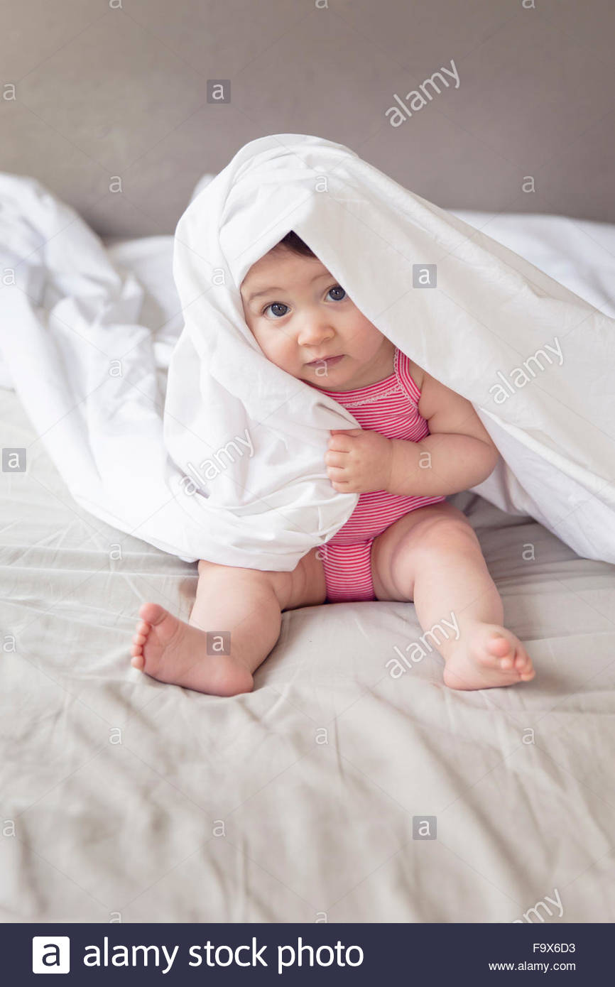 Girls Hiding Under Bed Sheet Stock Photos & Girls Hiding Under Bed