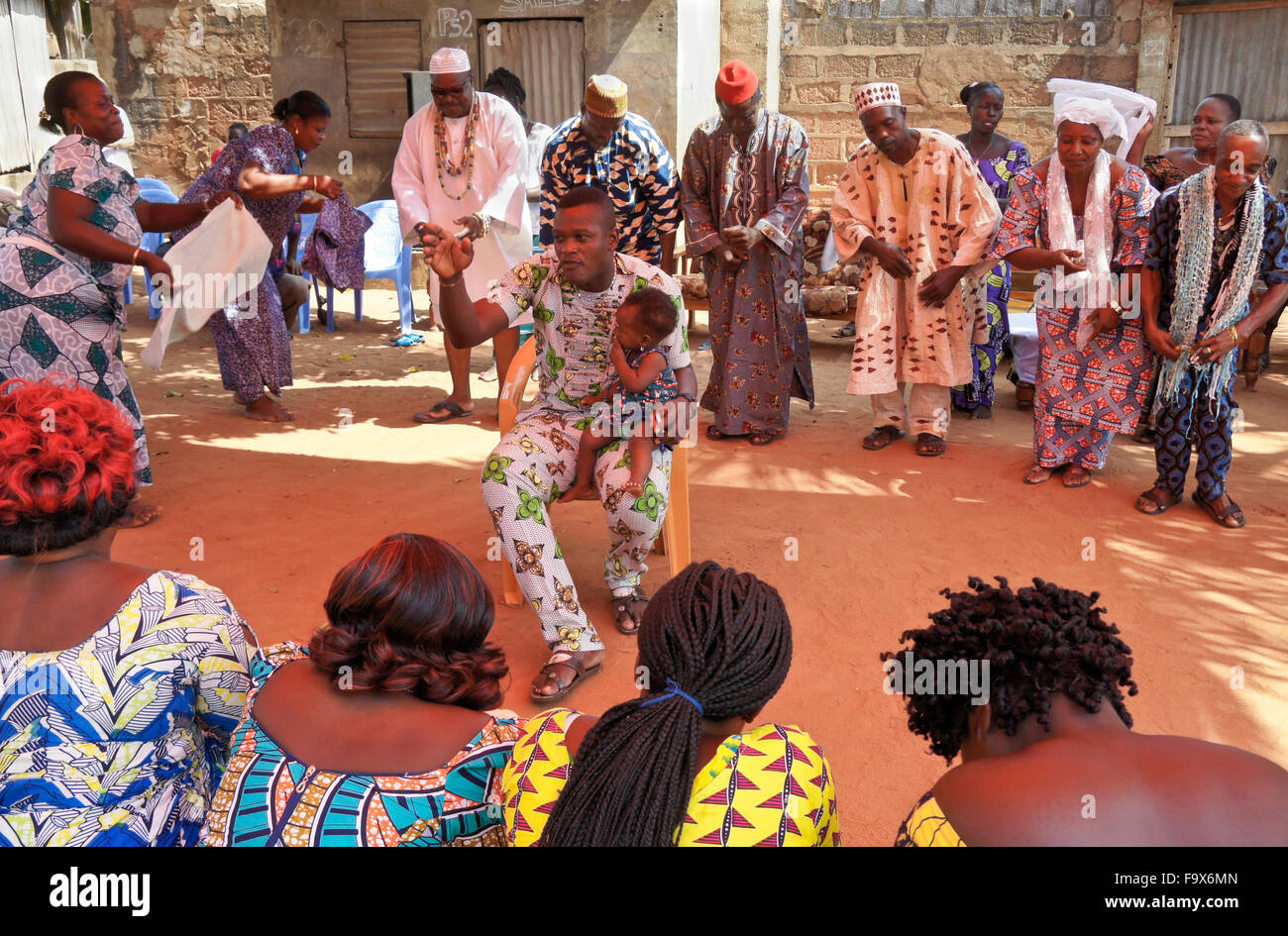 Ewe priest, priestess, dignitaries, and others participating in a Tron vodun (voodoo) ceremony, Lome, Togo Stock Photo