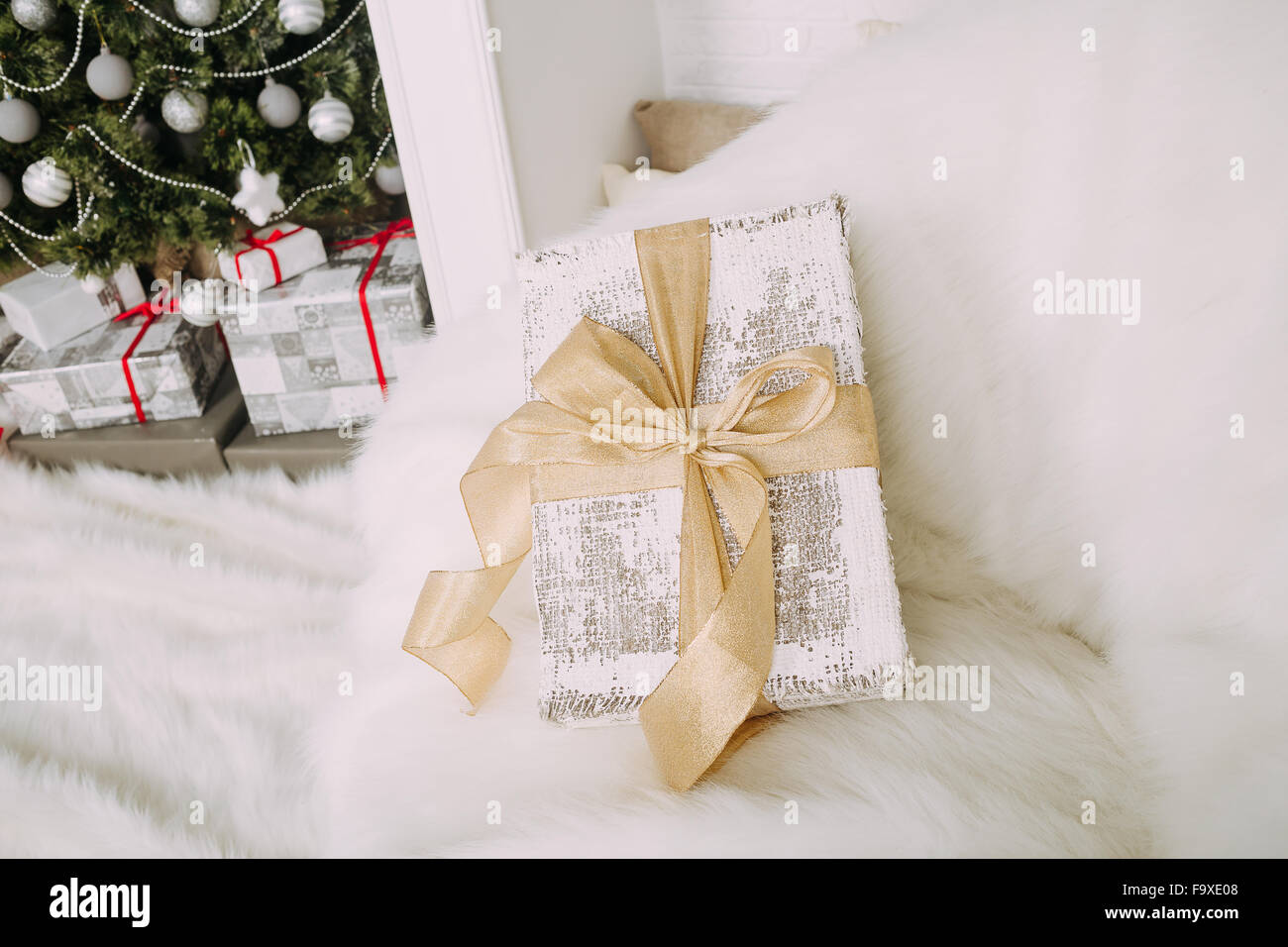 New Year's surprise on white fluffy chair Stock Photo
