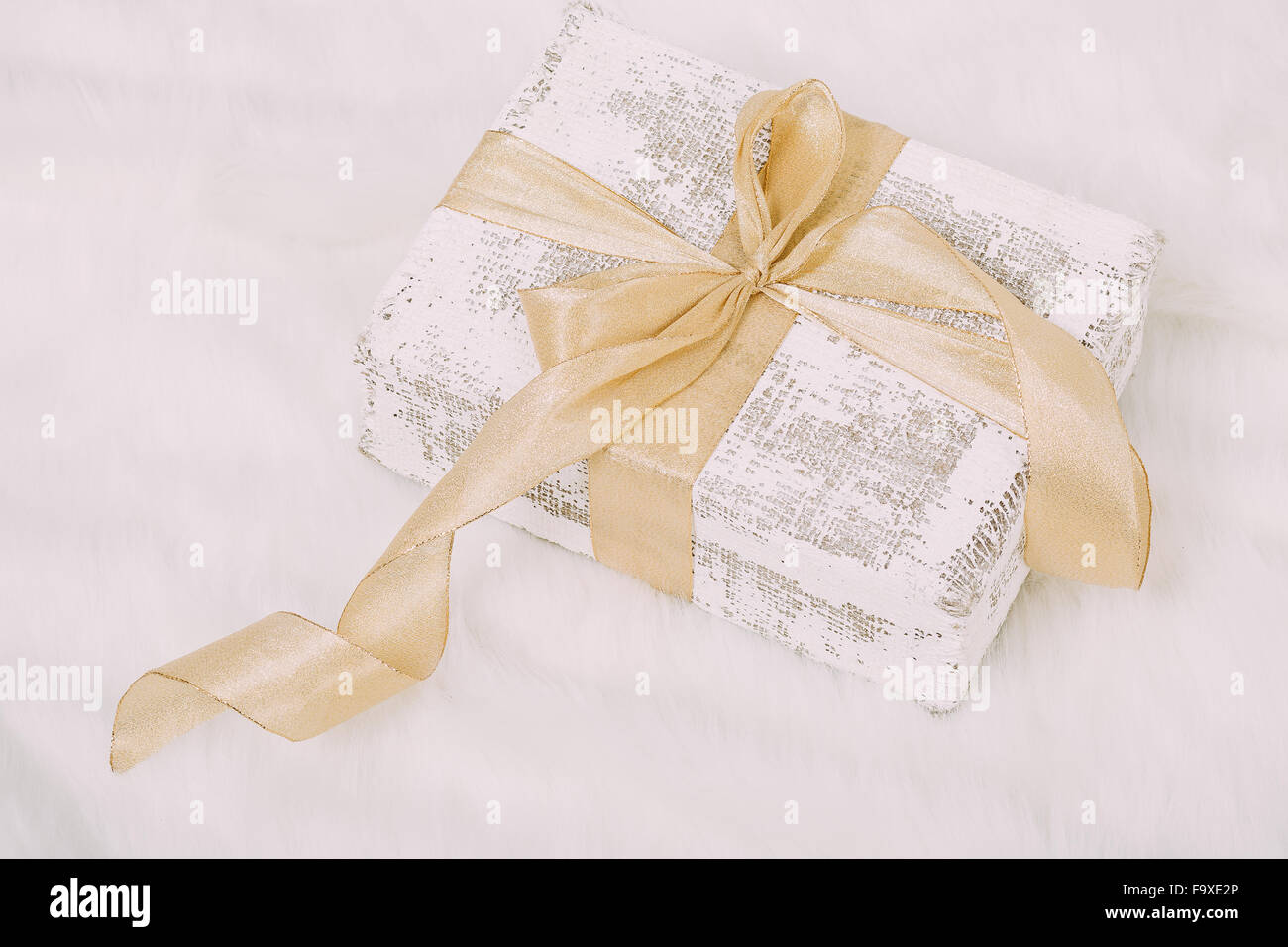 Beautiful Christmas gift on fluffy carpet Stock Photo