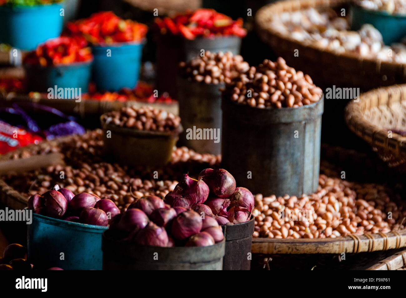 Peeled Nuts and Onions In Little Buckets at local market in Indonesia Stock Photo