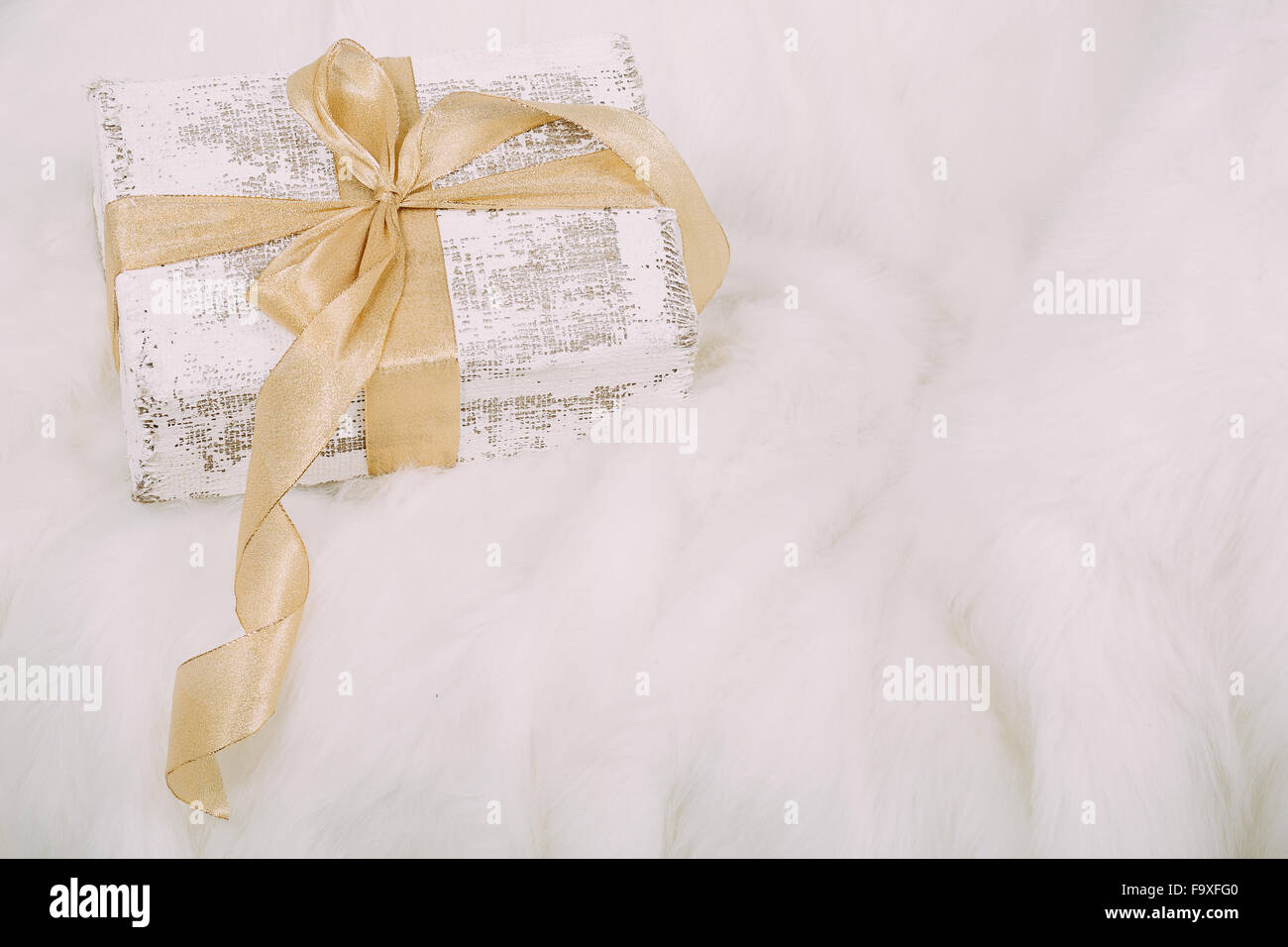 Beautiful Christmas gift on fluffy carpet Stock Photo